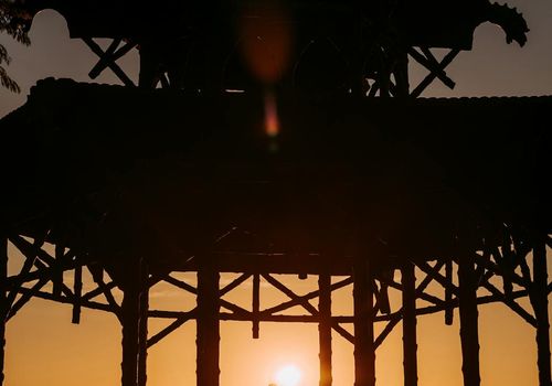 Silhouette of a meditating person radiating calm energy.